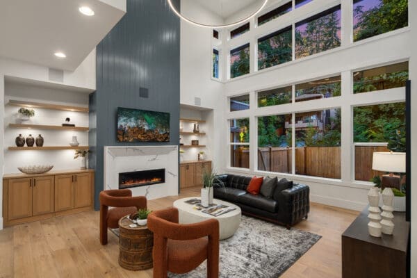 Tall slate blue fireplace in open concept floor plan living room